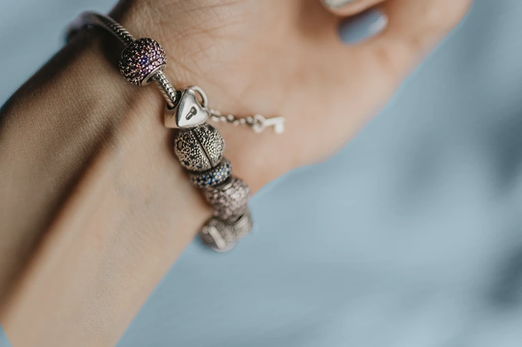Styling tips for 80s charm bracelets (How to incorporate them into modern outfits)